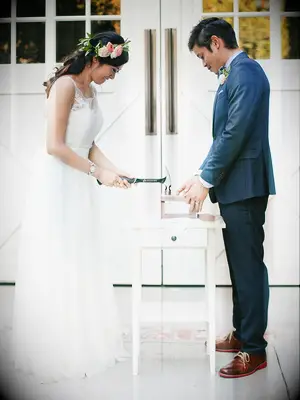 Sealing love letters into a box for a unity ceremony