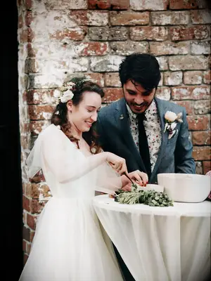 Bride and groom making guacamole during wedding unity ceremony