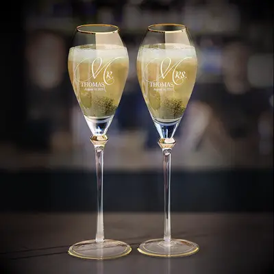 glass champagne flutes with gold trim and engraving
