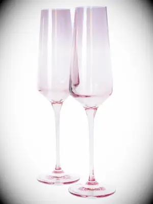 Pink colored champagne flutes for wedding