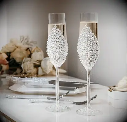 vintage inspired wedding champagne flutes decorated with pearl embellishments
