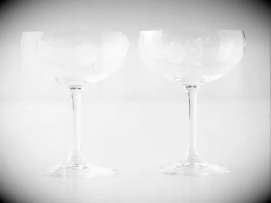 Etched floral champagne coupes for wedding