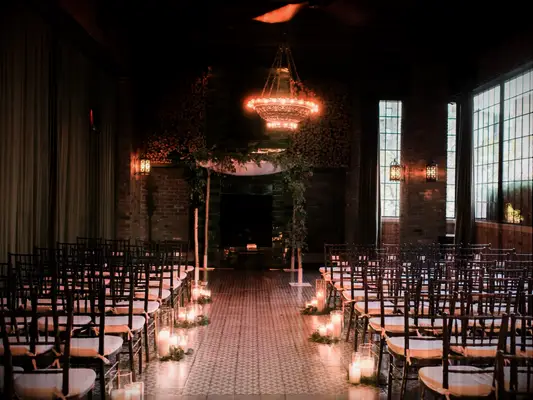 winter wedding ideas candle lined aisle