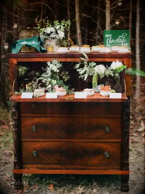 winter wedding idea DIY hot chocolate station on vintage wooden dresser
