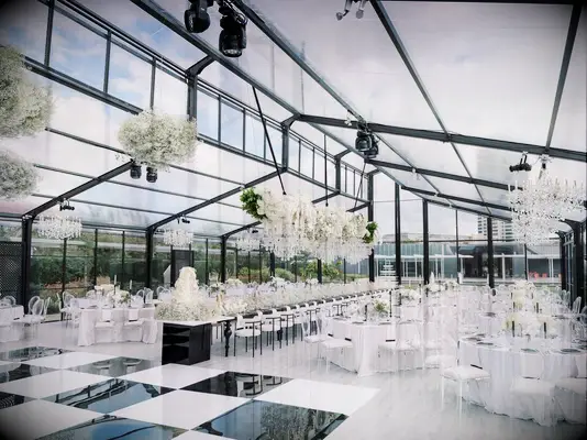 White reception space with checkered dance floor