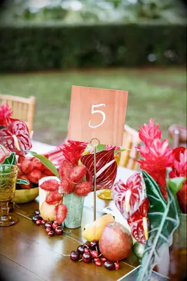 Red floral beside table numbers