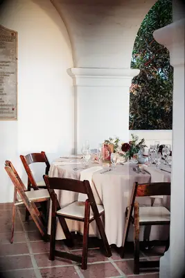 Beige table top with dark wooden chairs