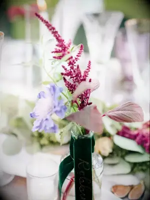 A bud vase wedding centerpiece with astilbe flowers