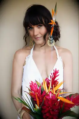 Stunning tropical bouquet with bright orange bird or paradise flowers for a summer wedding