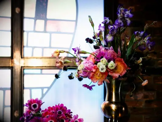 A church altar arrangement with purple iris flowers
