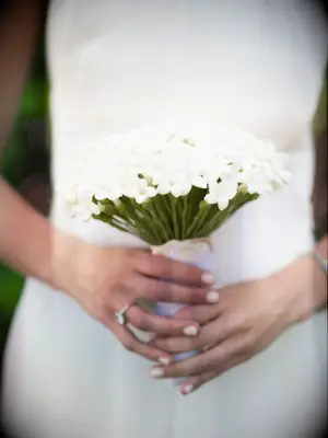 A bride holding stephanotis wedding bouquet