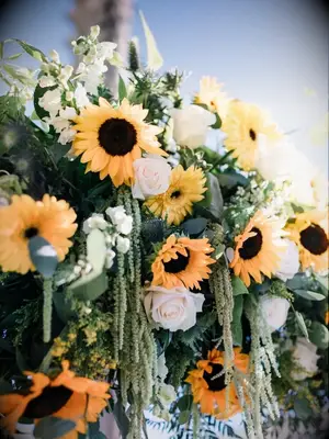 Sunflowers in wedding ceremony flower arrangement