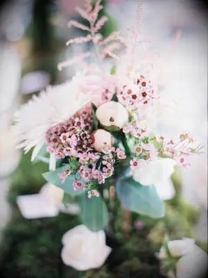 Pink wax flower blooms in wedding centerpiece