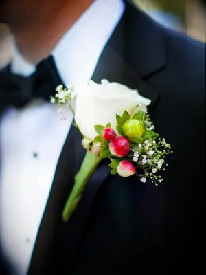 Groom with hypericum berry boutonniere
