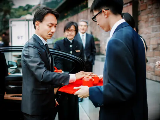 Touching apple during Chinese wedding