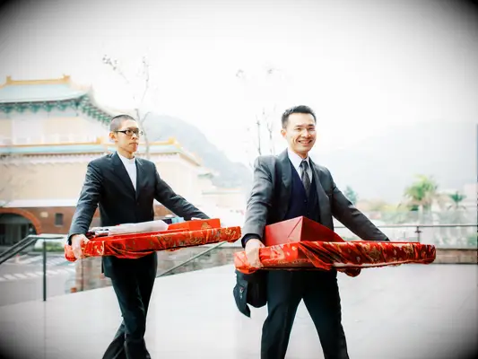 Six gifts being carried into Chinese wedding ceremony