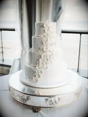 classic fondant wedding cake with white sugar flowers
