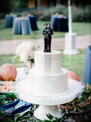 wedding cake with Day of the Dead-inspired cake topper