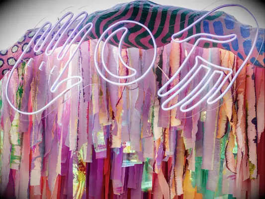 A modern summer-toned neon sign.