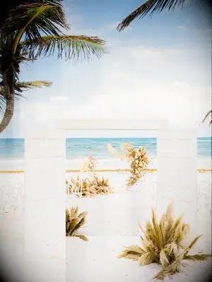 A sandy beach-themed ceremony space.