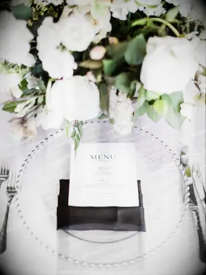 A crisp and modern white table setting.