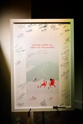 Ski-themed guest book sign on easel
