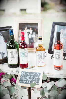 alternative wedding guest book idea anniversary wine bottles with custom labels