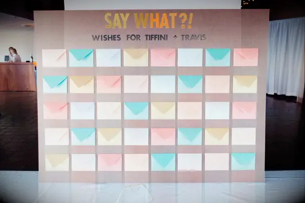 Wood board with paper envelopes for guest book display