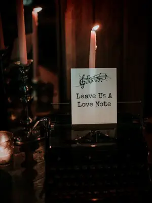 typewriter surrounded by taper candles