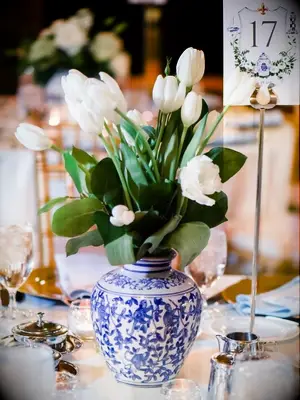 white tulips in chinoiserie vase