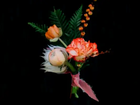boutonniere with orange carnation 