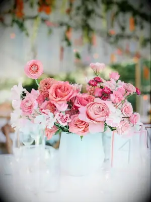 pink flower arrangement in white vase