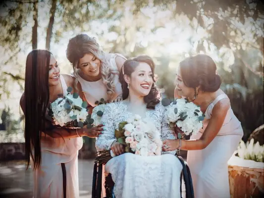 bride and bridesmaids holding hydrangea and eucalyptus wedding bouquets