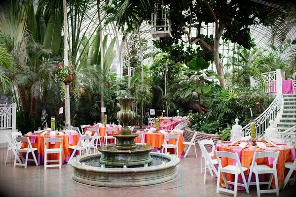 The tables are set for an outdoor wedding reception at Franklin Park Conservatory and Botanical Gardens in Columbus, Ohio