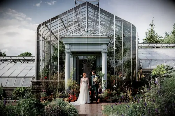 A garden glasshouse wedding reception at Wave Hill in Bronx, New York