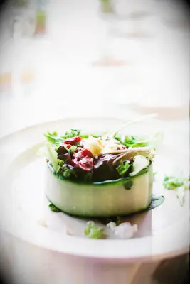 wedding menu idea for spring fresh seasonal salad presented in a cucumber bowl
