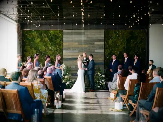 A modern indoor wedding ceremony space at Moss Denver in Denver, Colorado