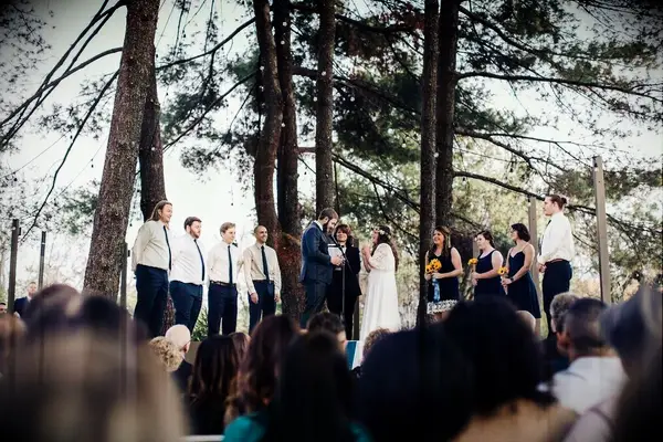 A couple tie the knot in a natural outdoor wedding ceremony space at Studio 615