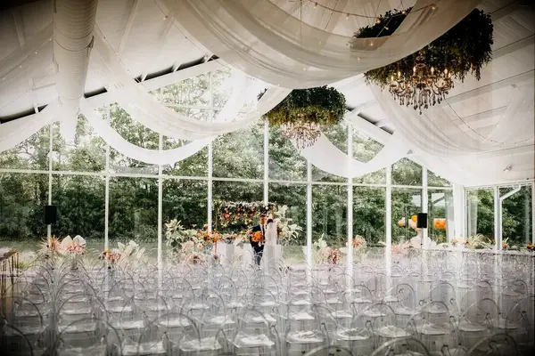 An indoor-outdoor ceremony space at Greenhouse Two Rivers in Highlandville, Missouri