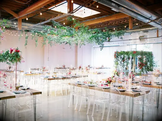 A romantic indoor wedding reception area at Skylight