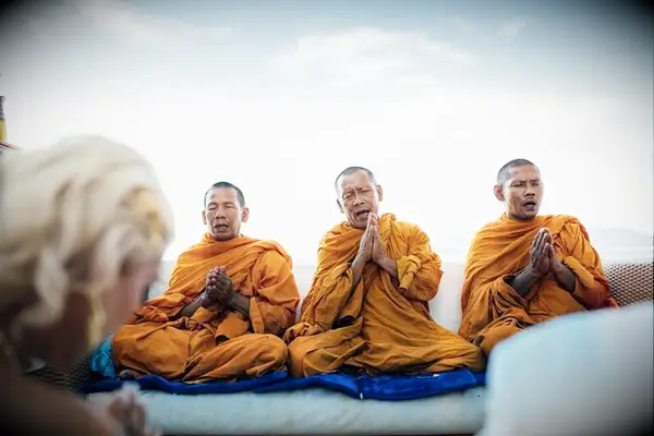 Monks praying during traditional Thai wedding