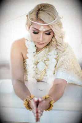 Bride during traditional Thai white thread ceremony