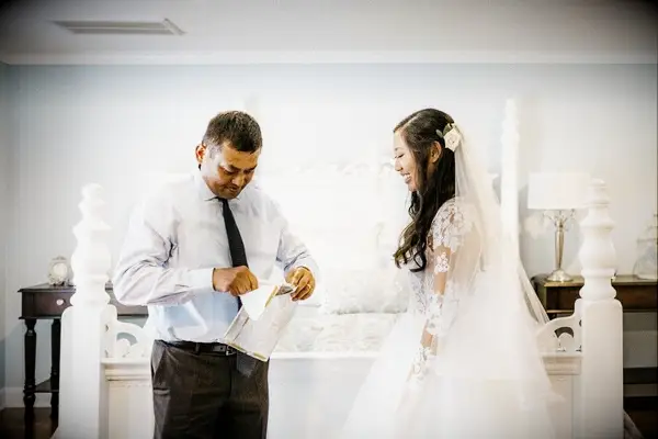 Bride giving her father a wedding-day gift