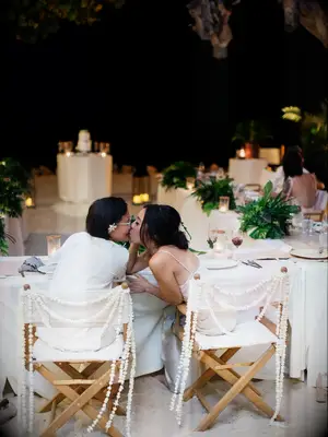 Couple kissing during wedding reception in Thailand