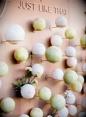 Soccer Ball Escort Card Wall in warm beige tones