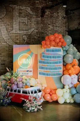 Escort Card Display With Balloons for a retro-style wedding reception