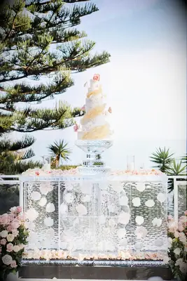A wedding cake and ice sculpture display