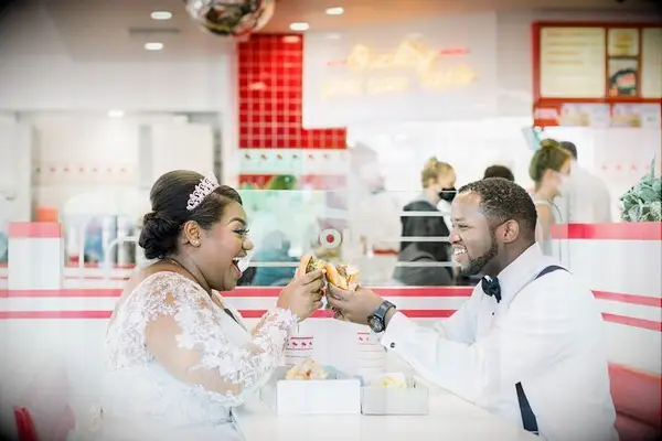 Couple sharing burger at In 