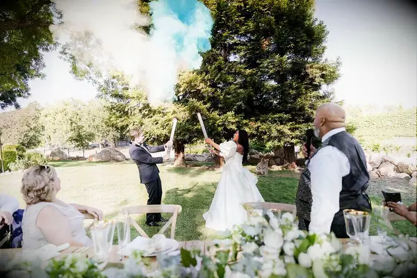 Fun smoke bomb baby reveal for your wedding reception