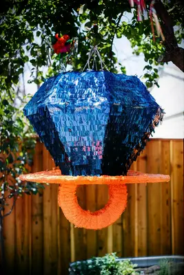 Fun retro wedding Piñata in the shape of a blue ring pop